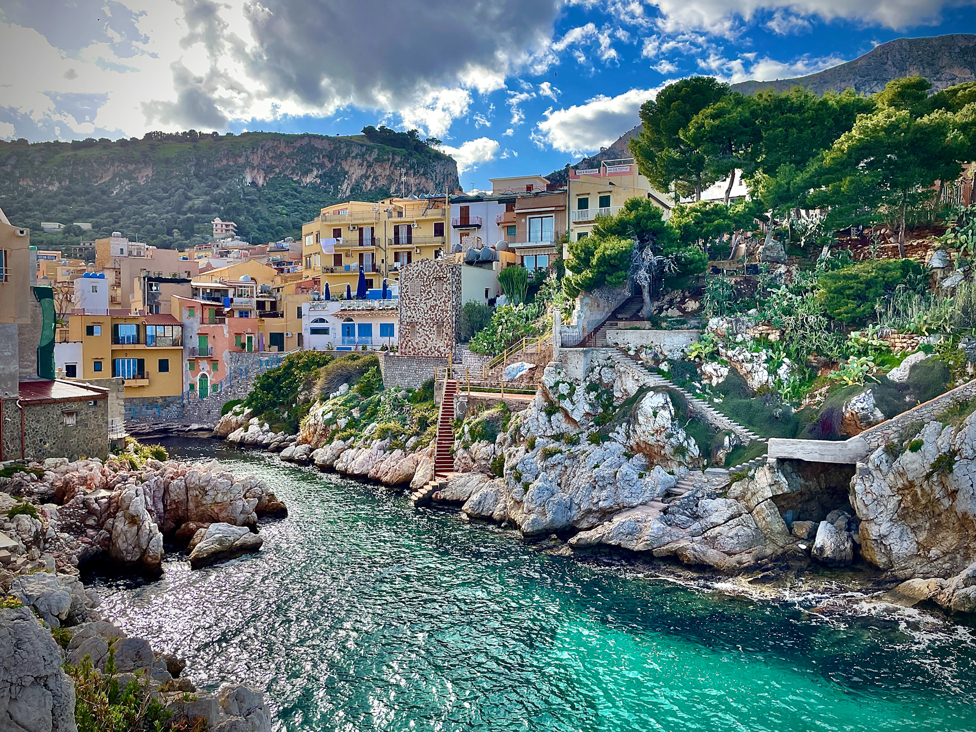 A river running through a lush green hillside