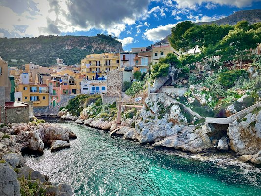 A river running through a lush green hillside — Sicily, Italy