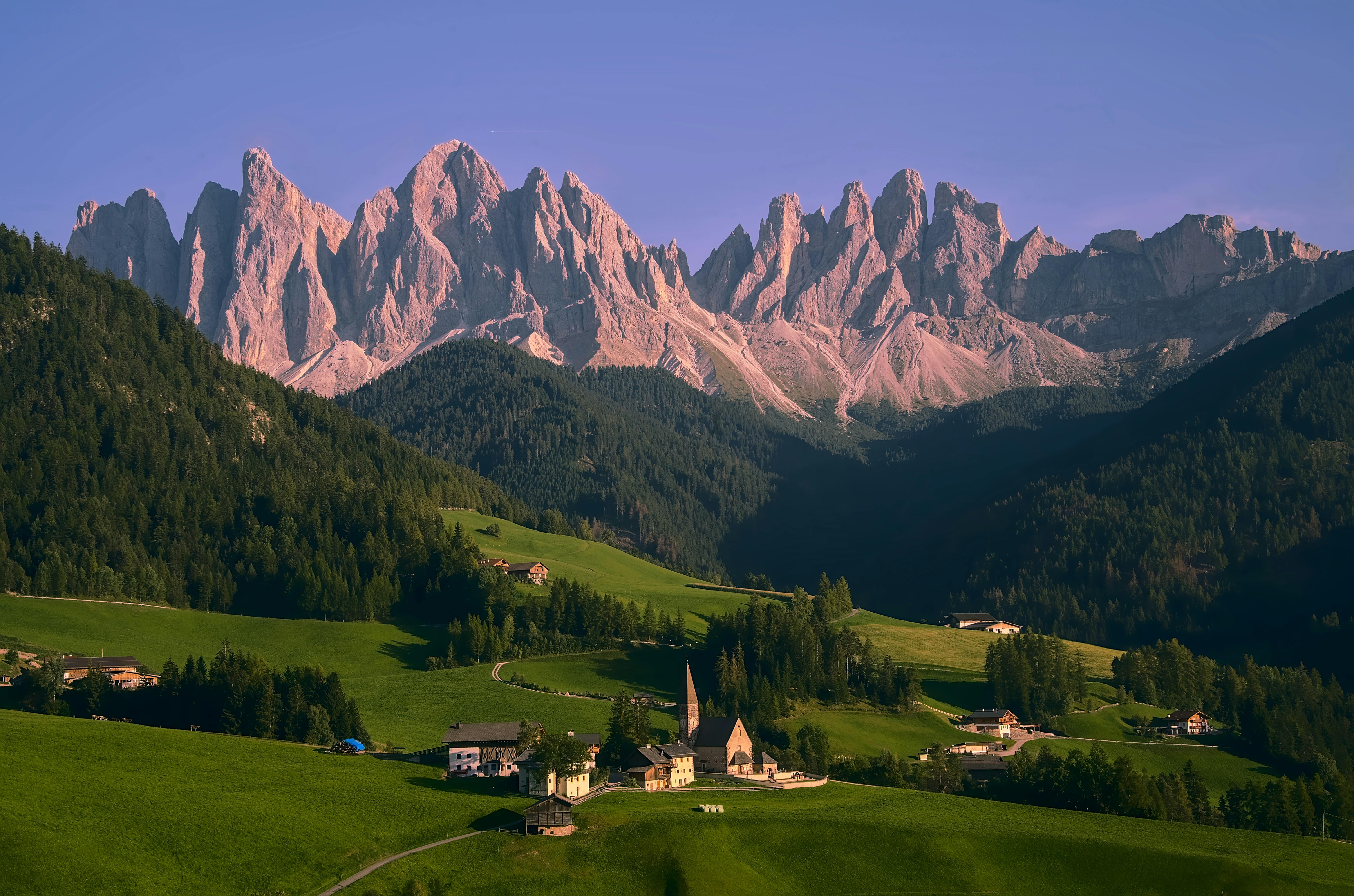 A view of a mountain range with a village in the foreground