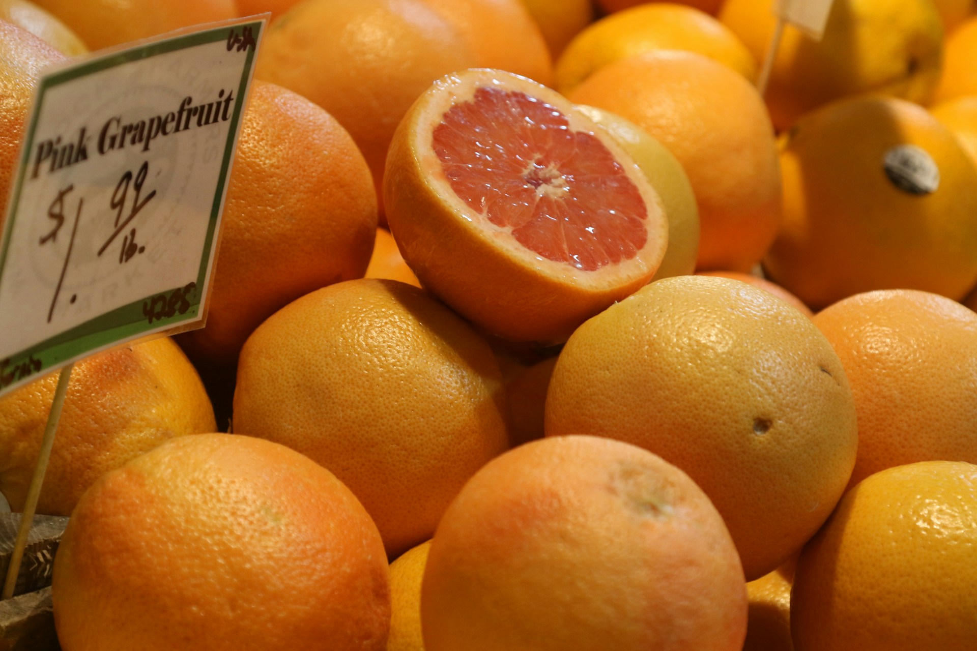 A pile of oranges sitting next to each other