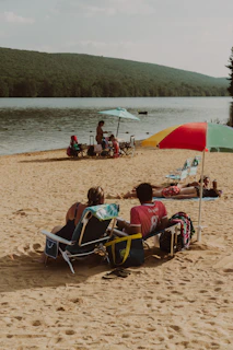 Sandy lake beach with picnic area at Rhea Springs Recreation Area