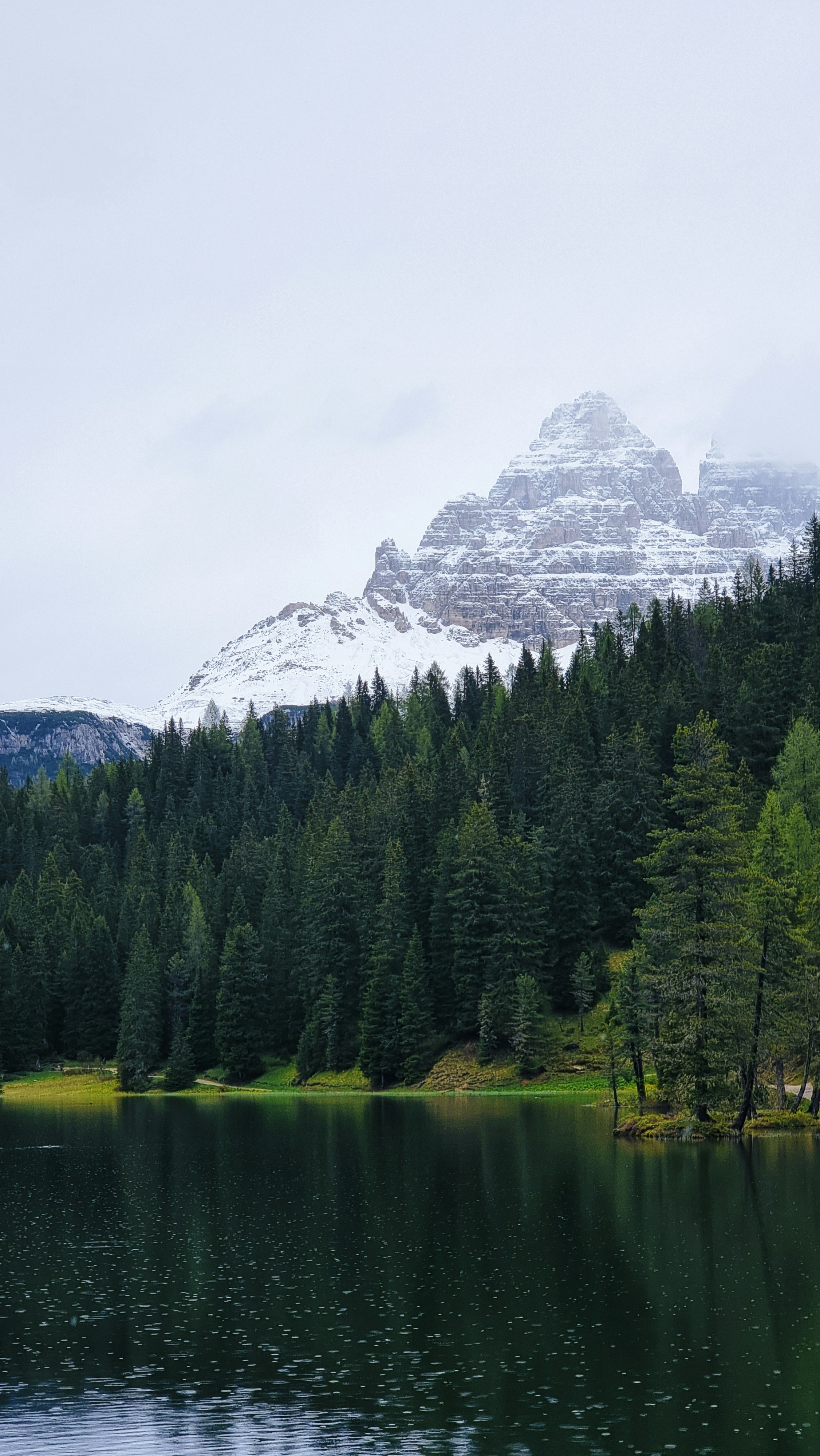 A lake with a mountain in the background