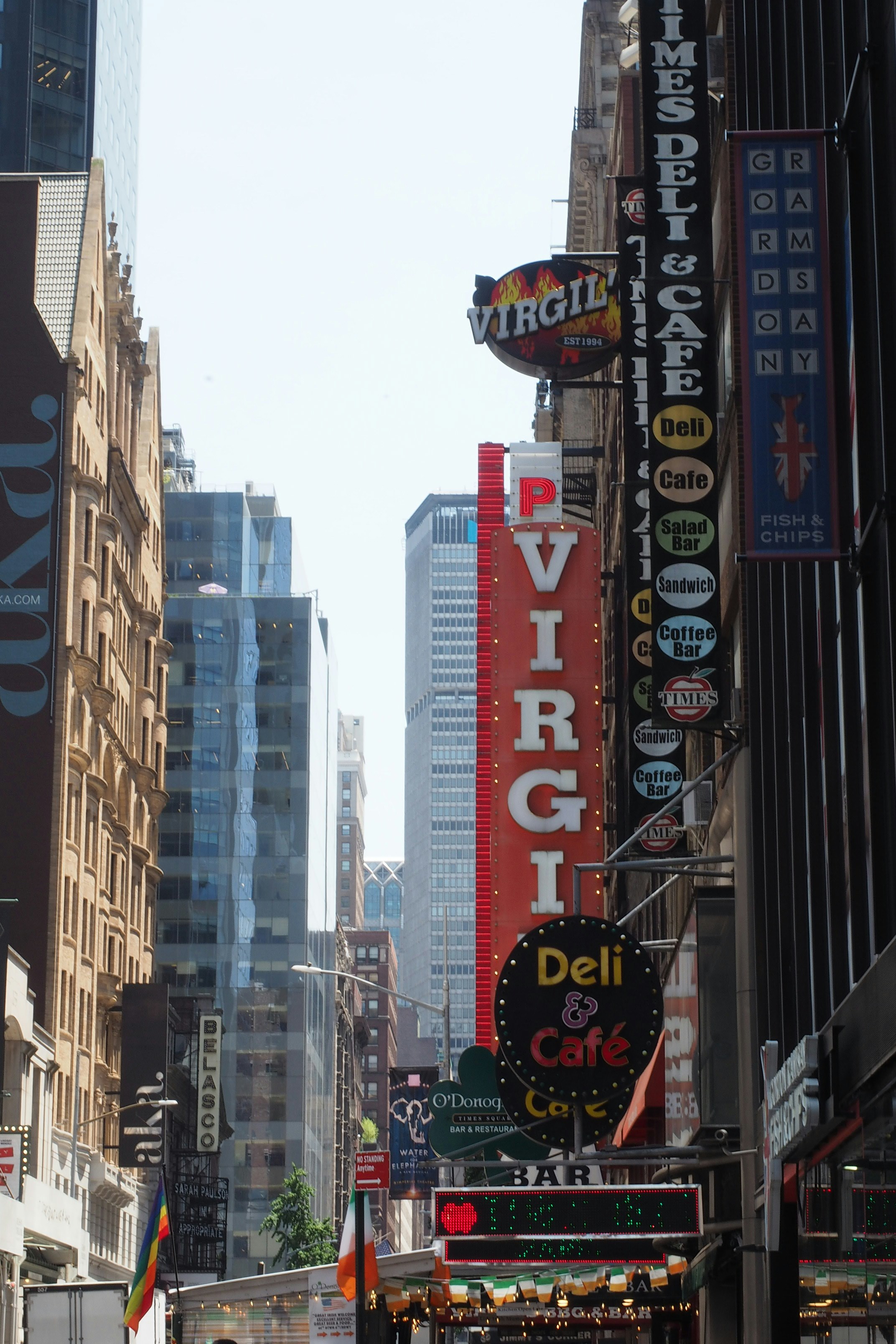 A city street filled with lots of tall buildings