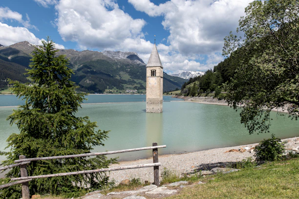 A large body of water with a clock tower in the background