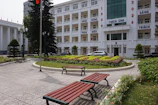 A couple of benches sitting in front of a building