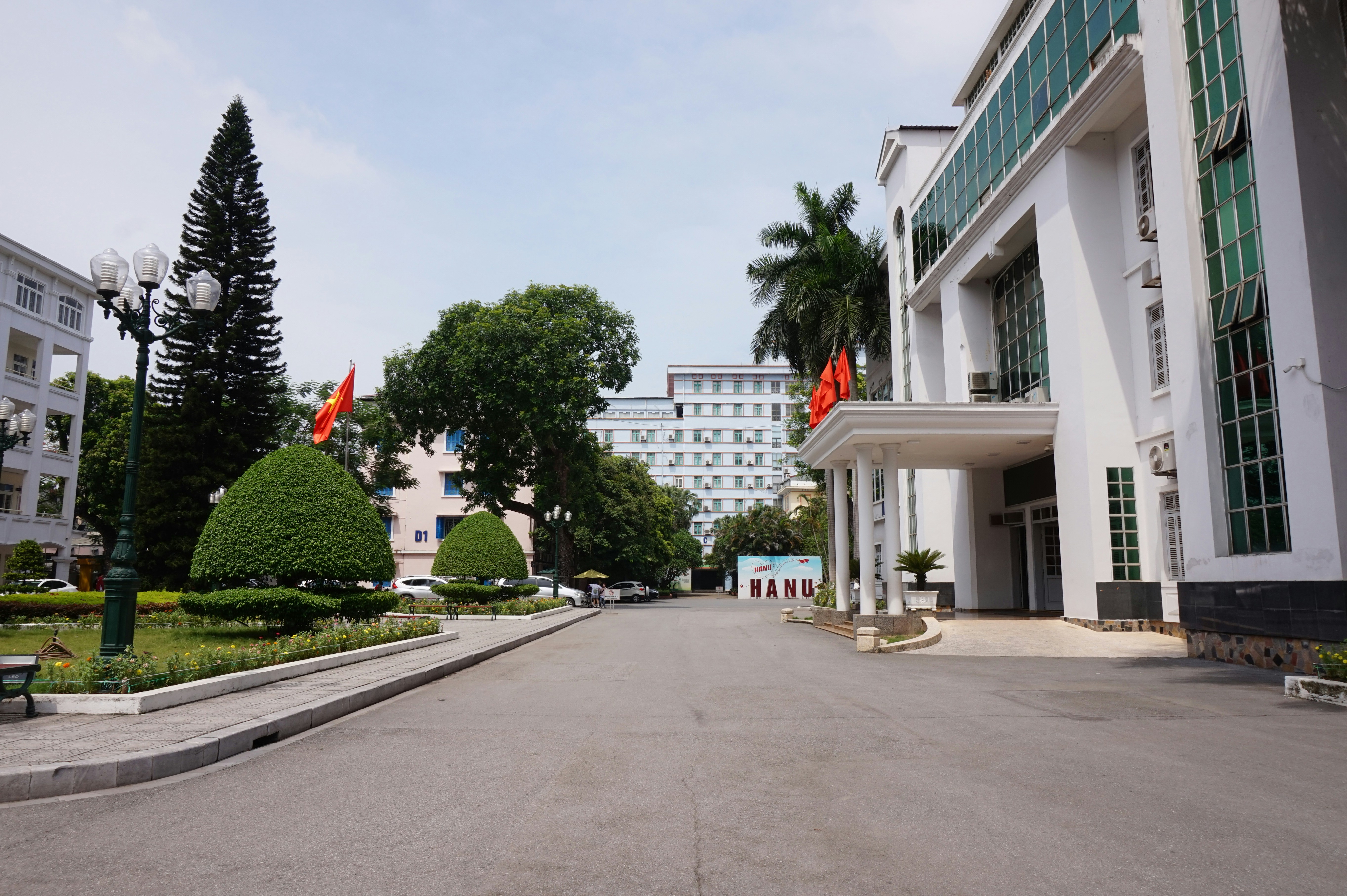 A large building with a lot of trees in front of it