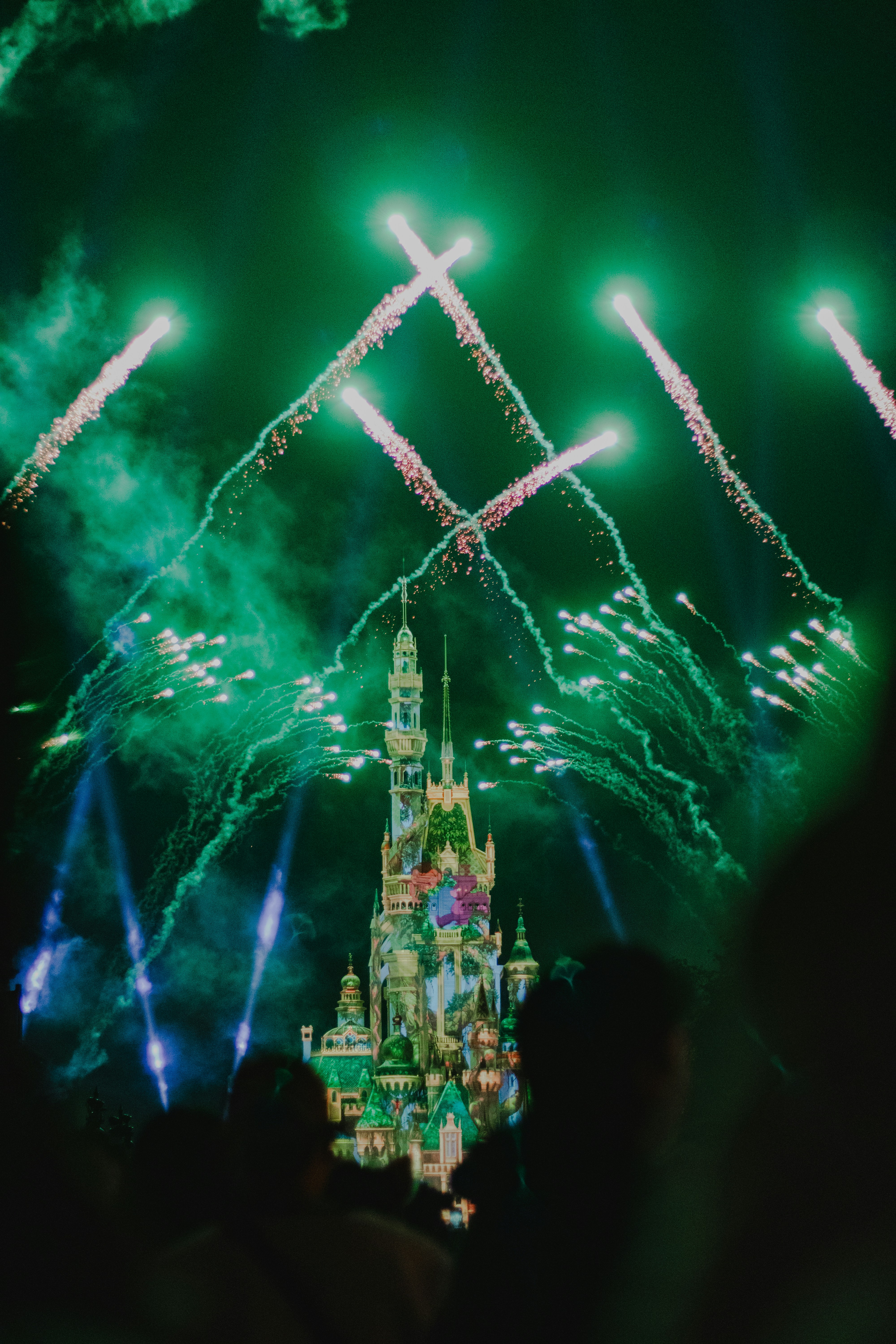 A castle with a lot of fireworks in the sky