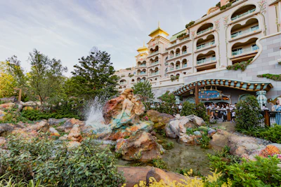 A large building with a waterfall in front of it