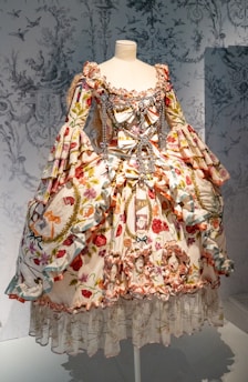 A dress on display in a glass case
