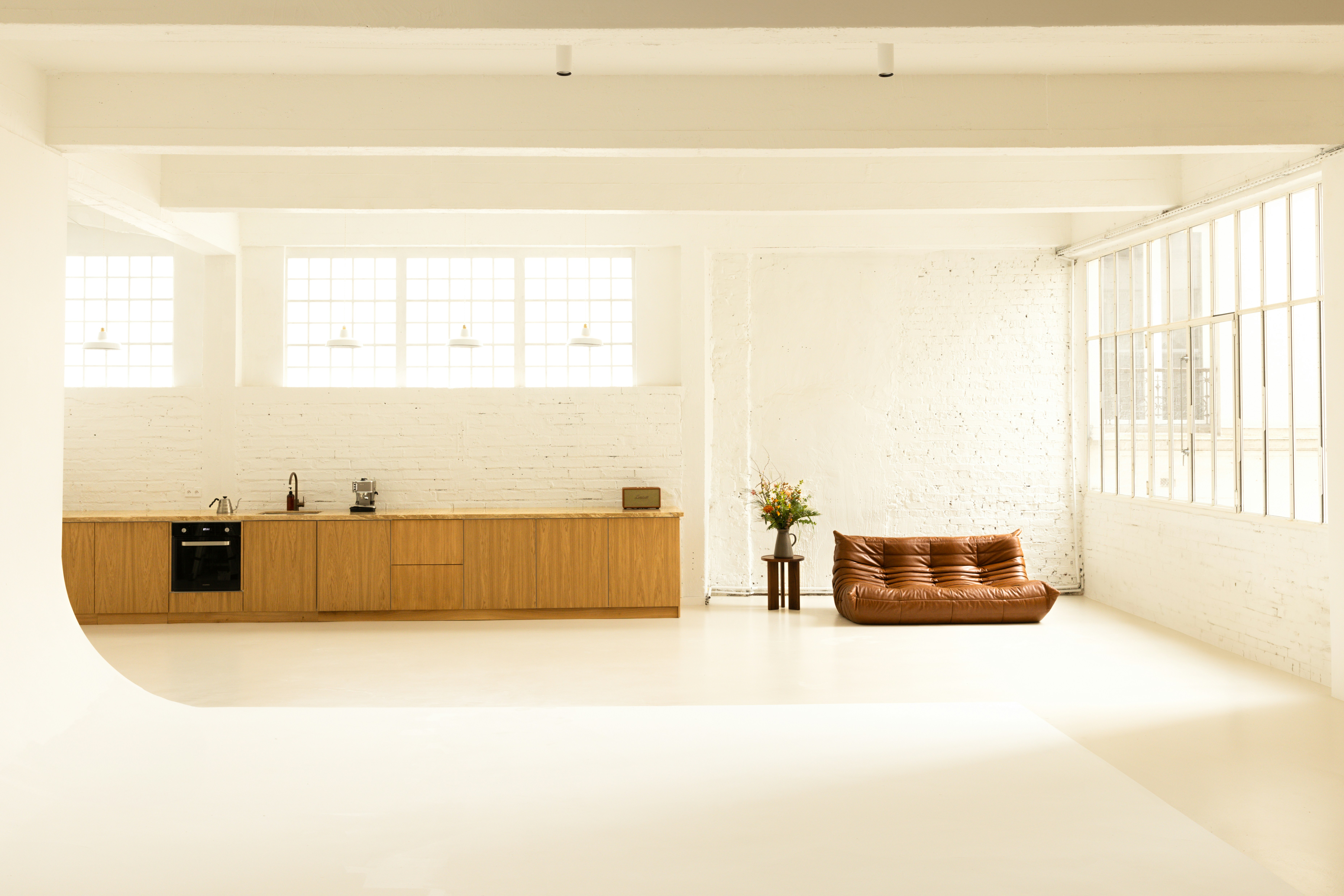 A room with a couch and a table in it