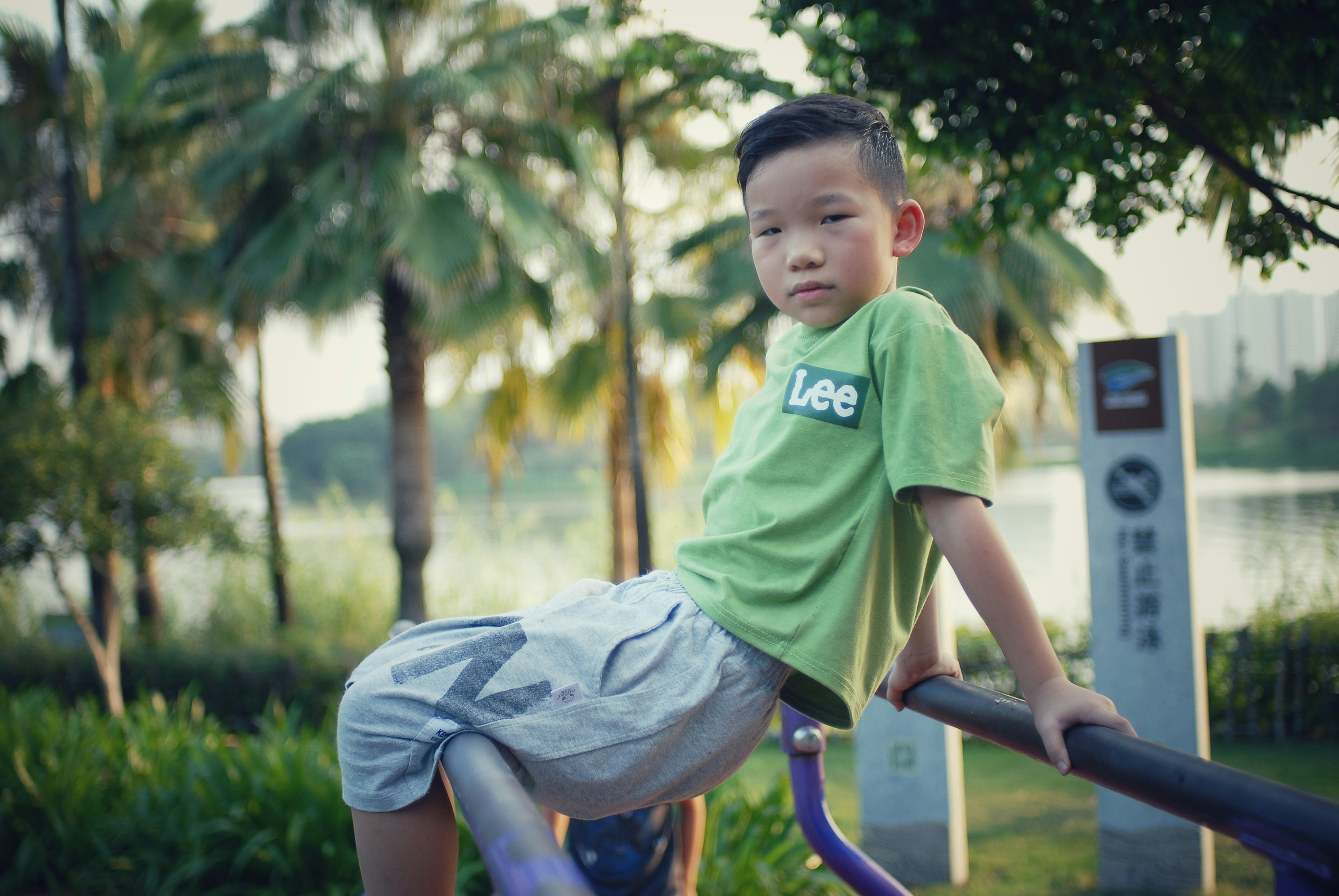 A young boy is playing on a playground