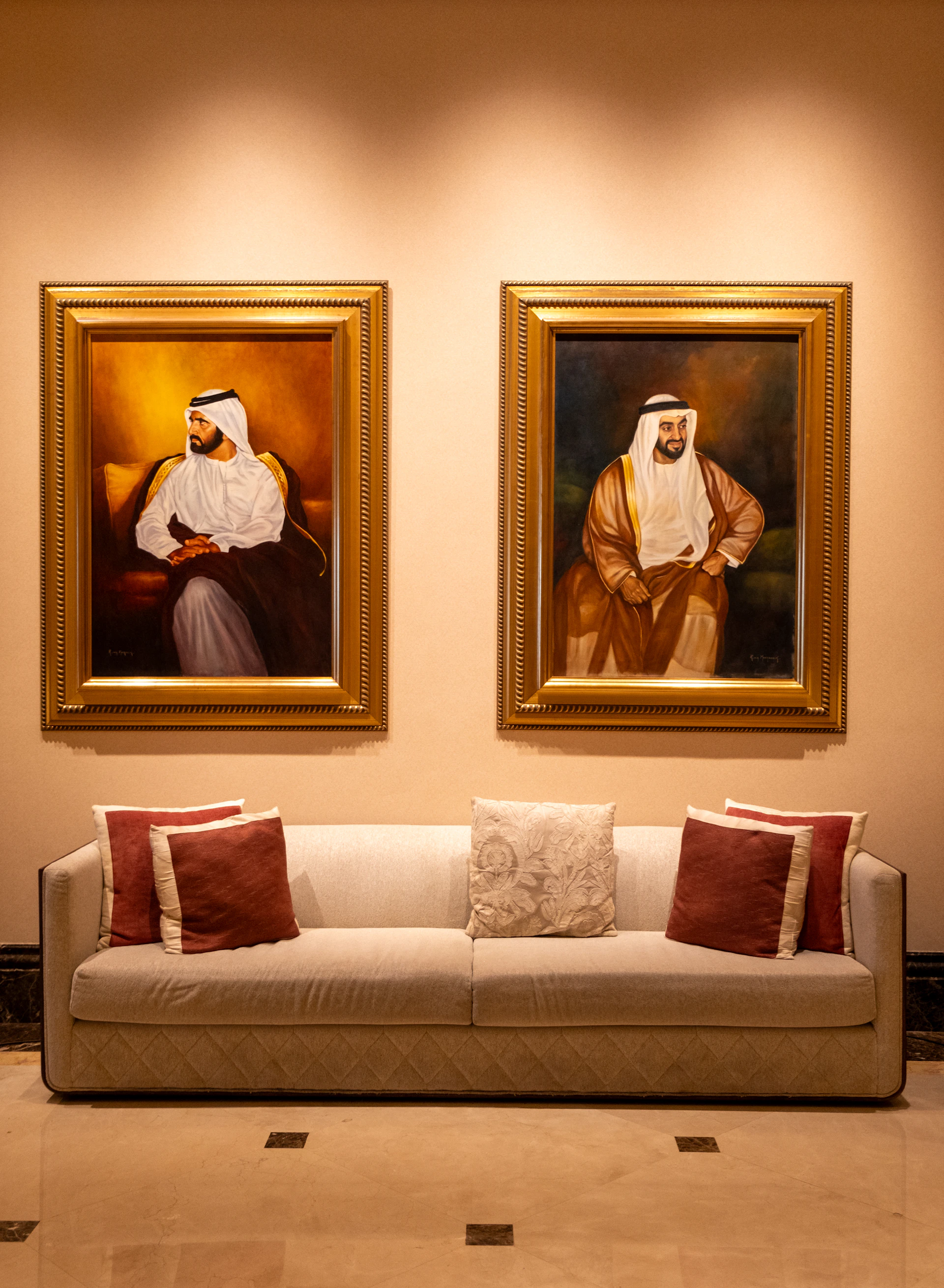 A living room with two paintings on the wall