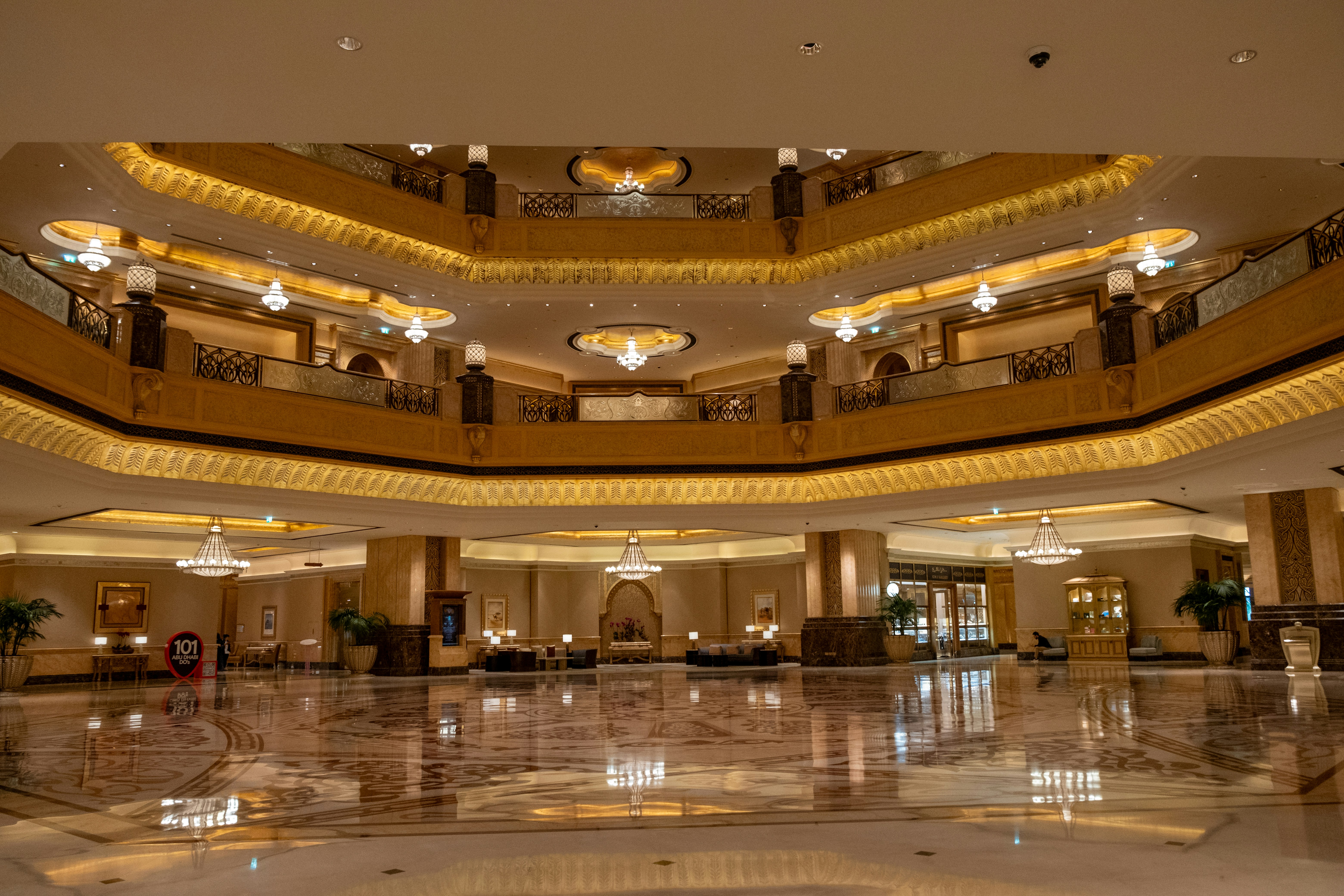 A large lobby with a circular ceiling and chandelier