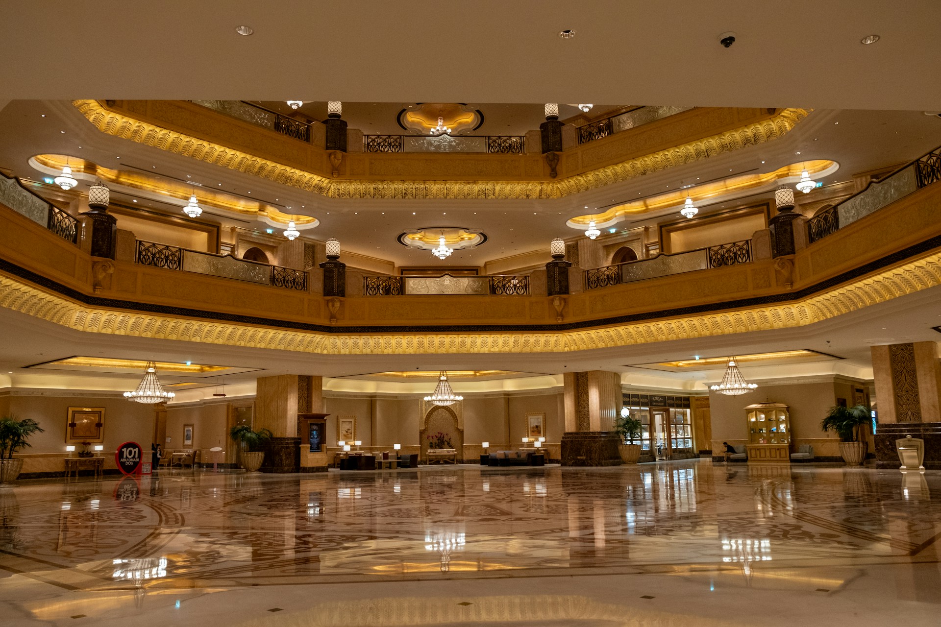 A large lobby with a circular ceiling and chandelier