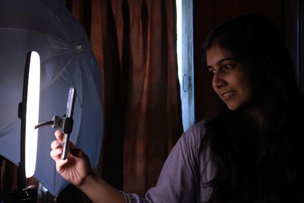 An Indian content creator recording with a ring light