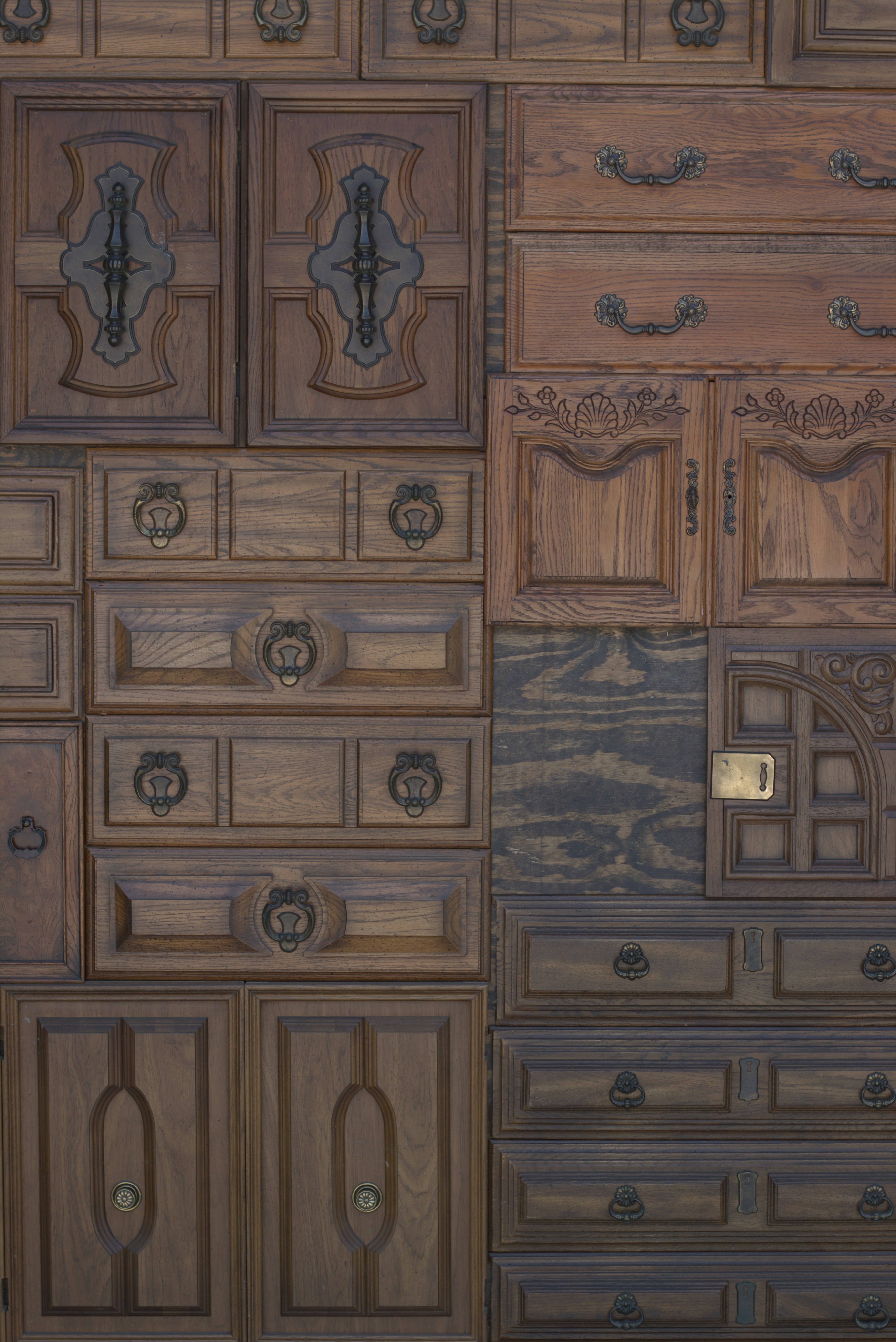 A large wooden dresser with many drawers