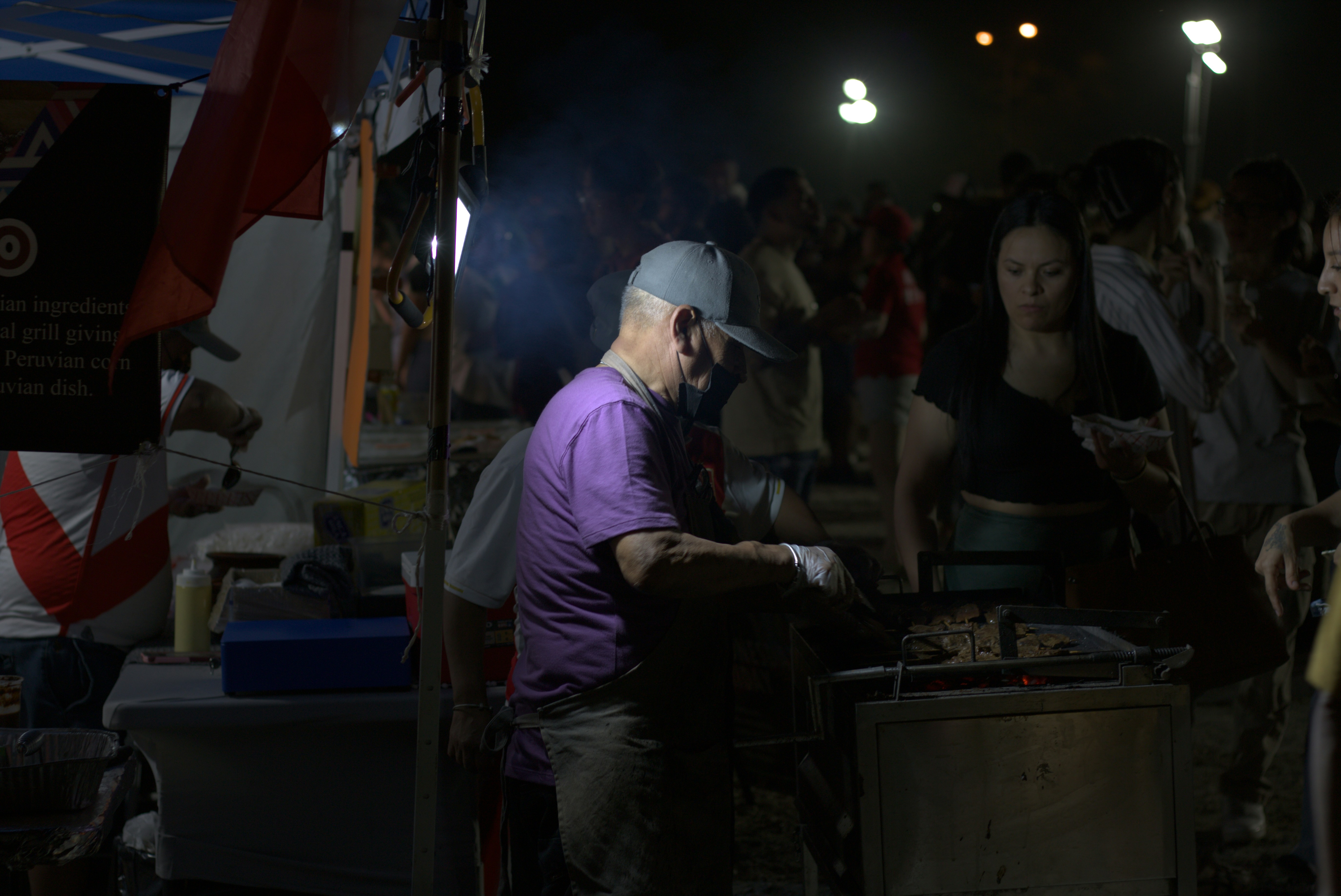 A group of people standing around in a room