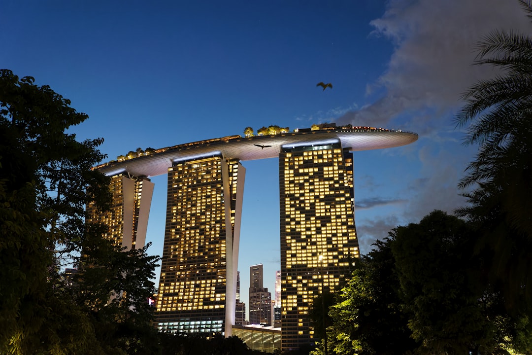 A very tall building with a lot of lights on it, Singapore