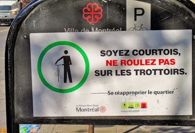 A sign that is on the side of a street