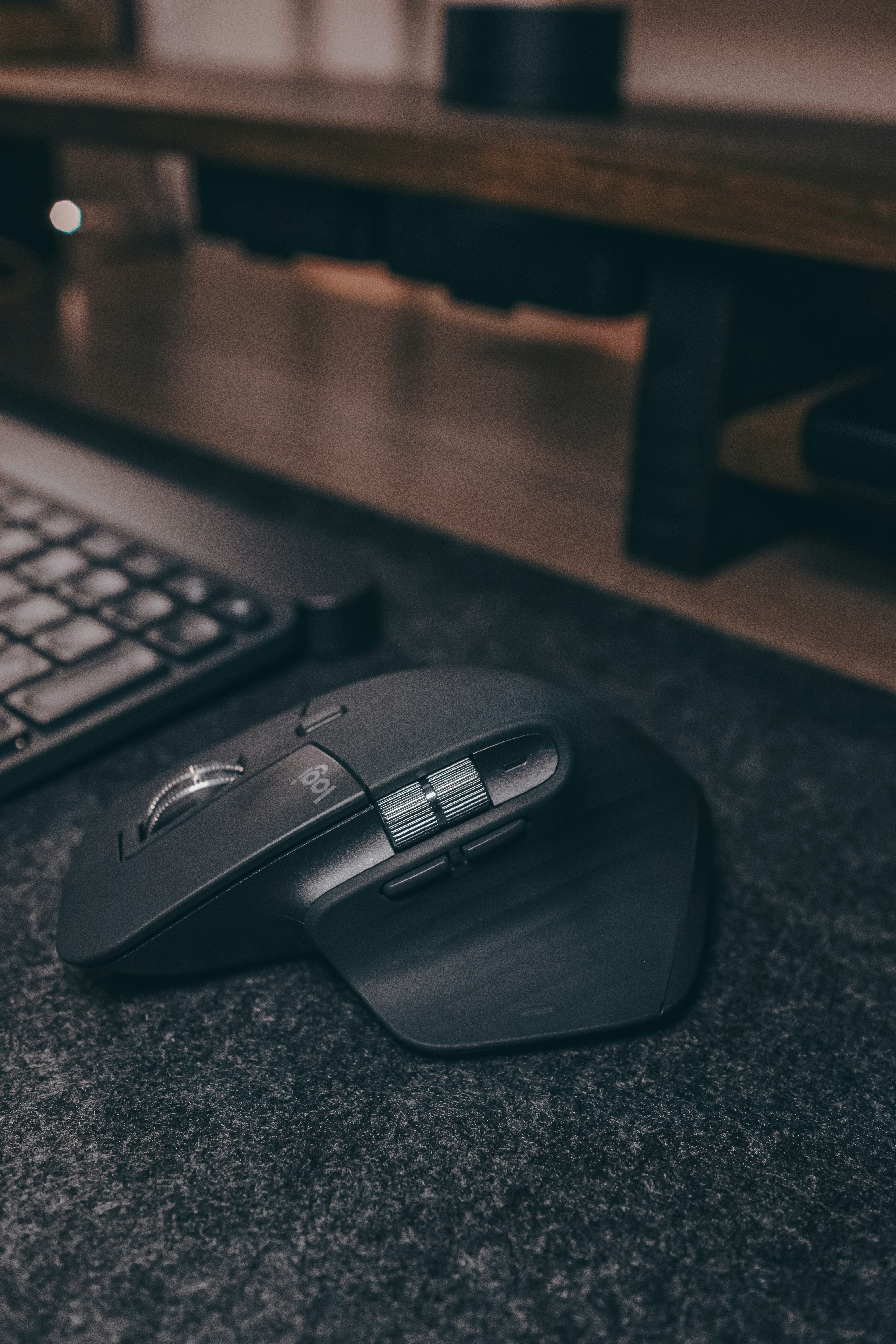 Gray Logitech MX Master 3S wireless mouse on desk surface