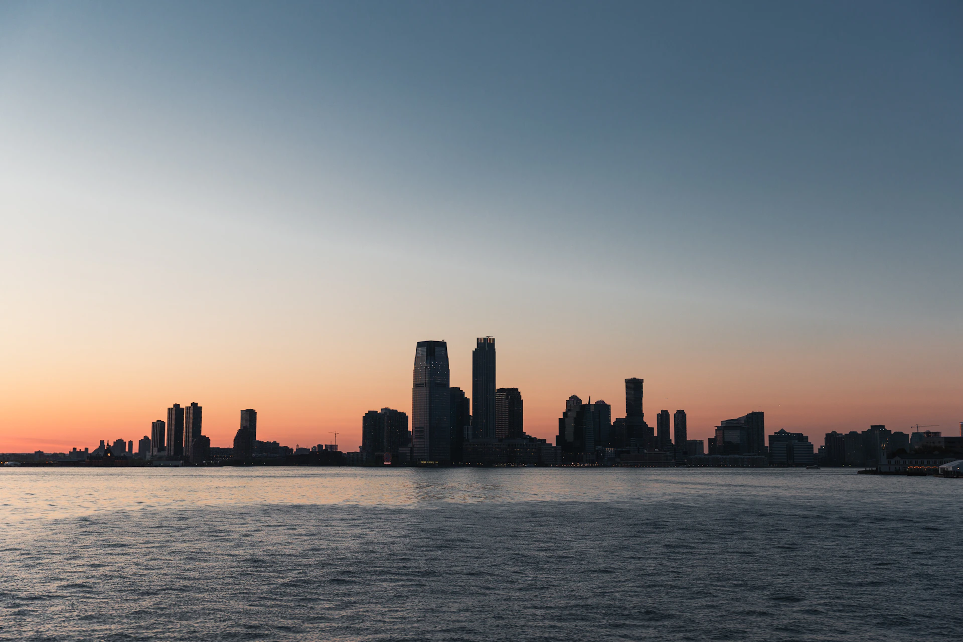 A large body of water with a city in the background