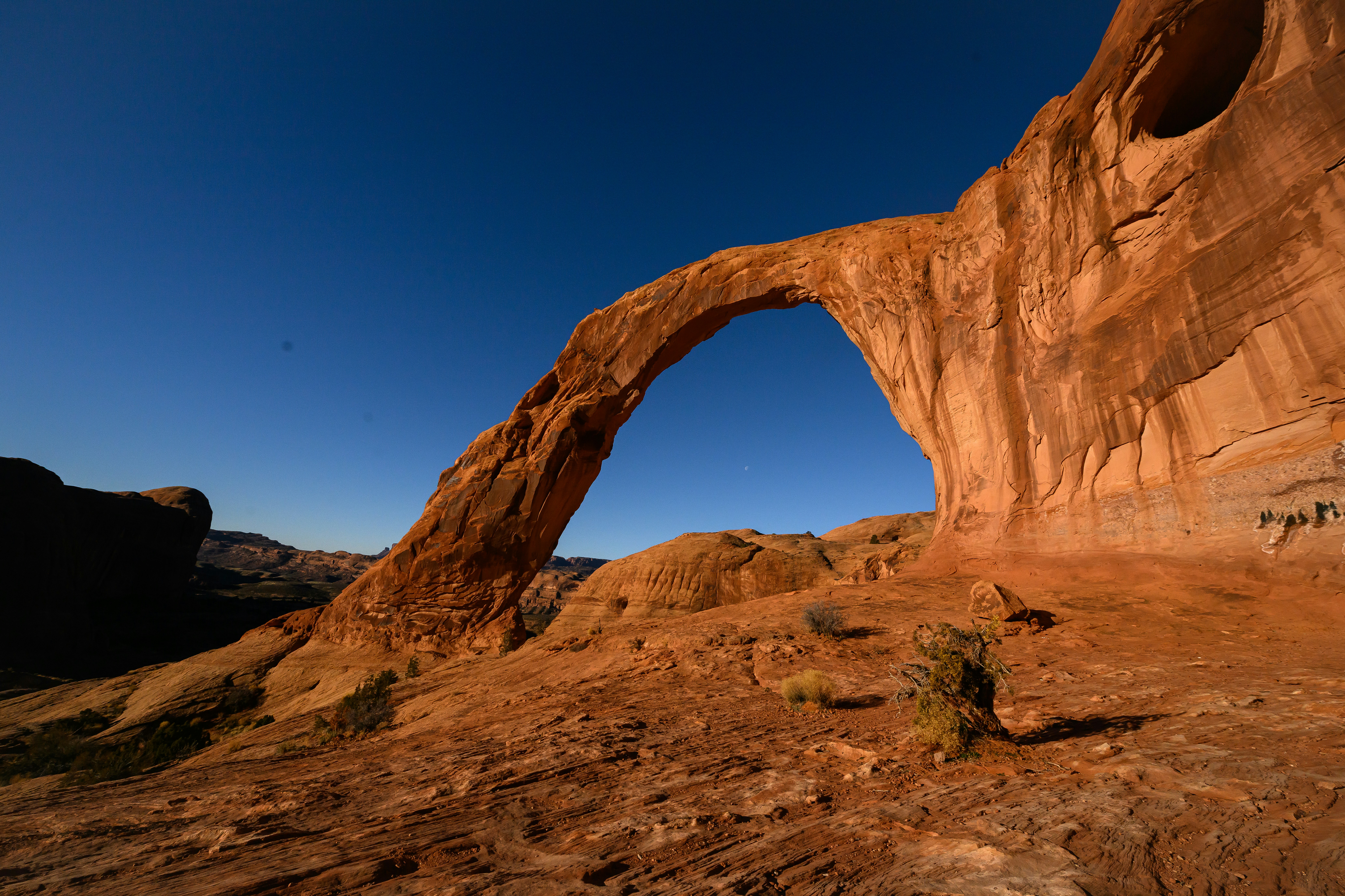 A rock arch in the middle of a desert photo – Free Corona arch Image on ...