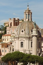 A large white building with a clock on top of it