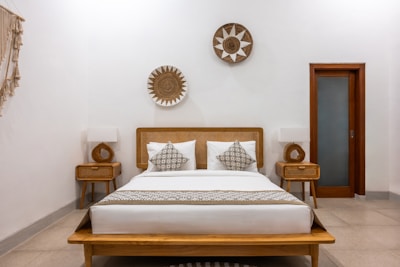 A bed sitting in a bedroom next to two nightstands