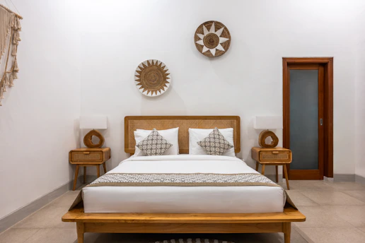 A bed sitting in a bedroom next to two nightstands