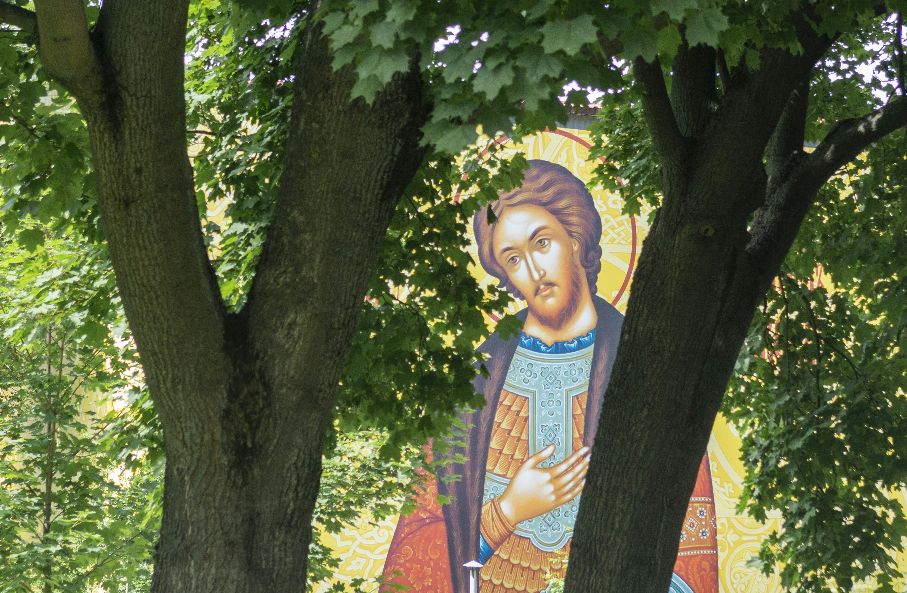 A painting of a woman holding a baby in a park, 