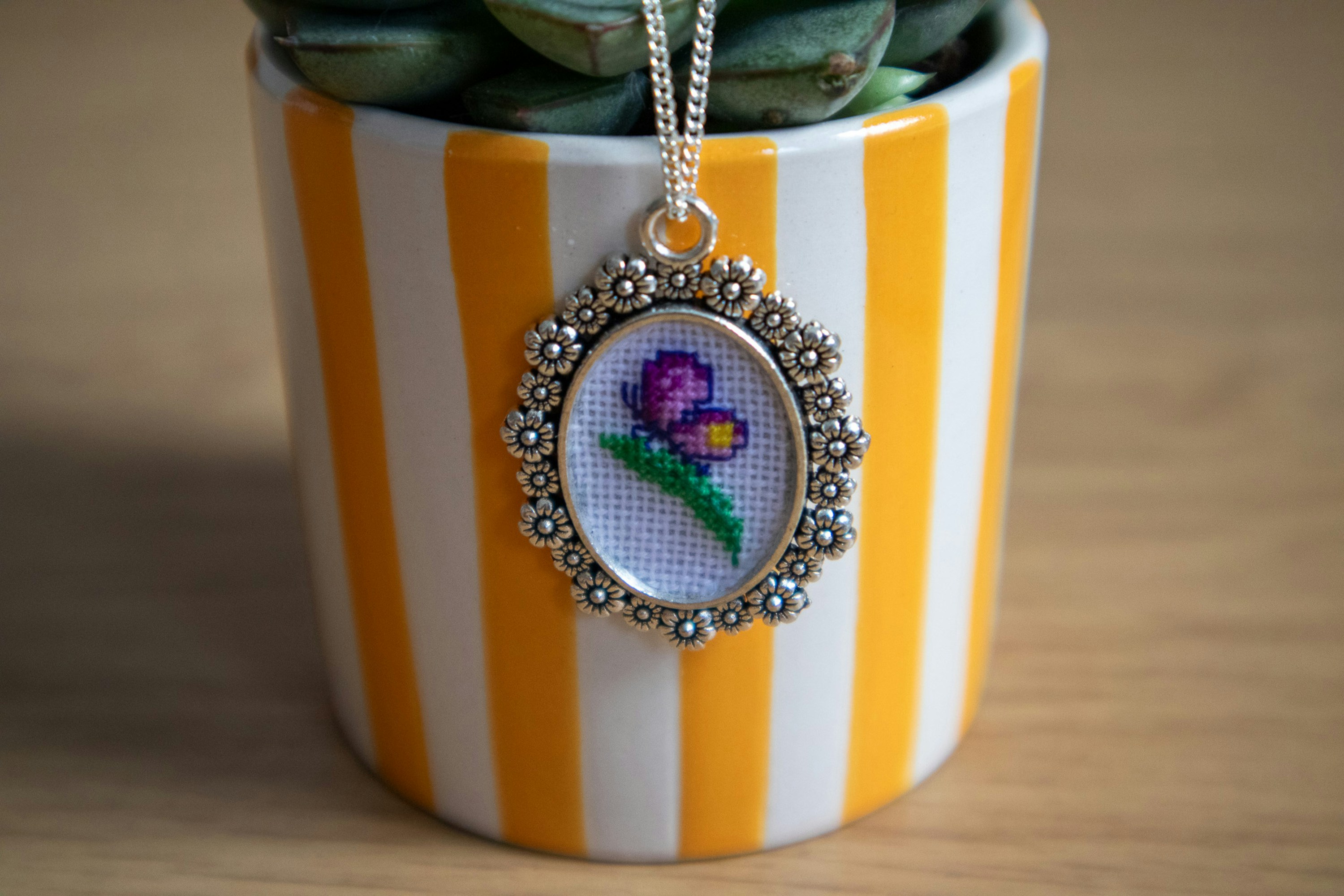 A potted plant sitting on top of a wooden table