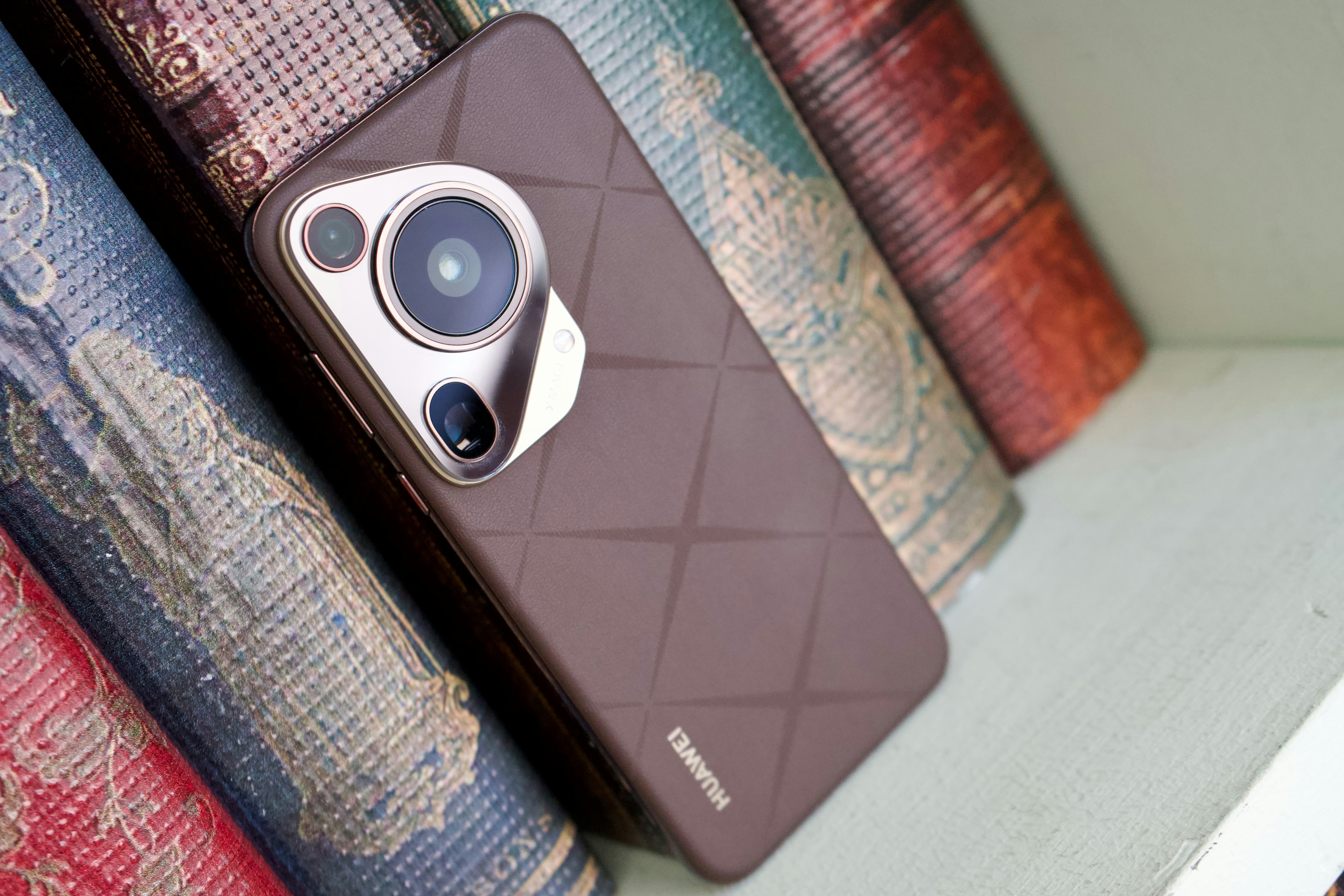 A close up of a cell phone on a shelf