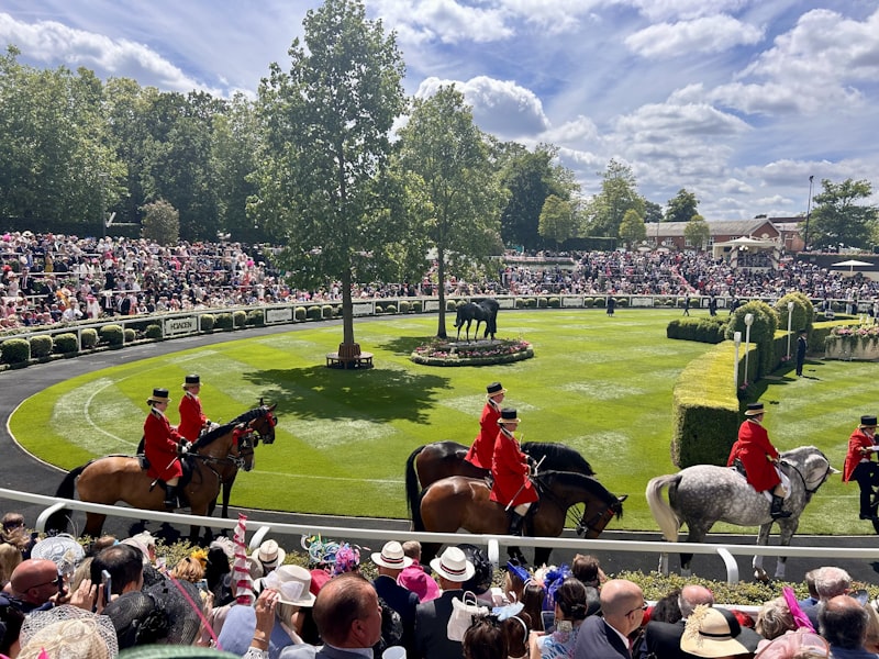 Horses and riders on the track at Ascot Racecourse, UK