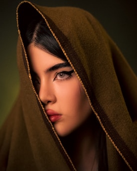 A woman with a hood on her head