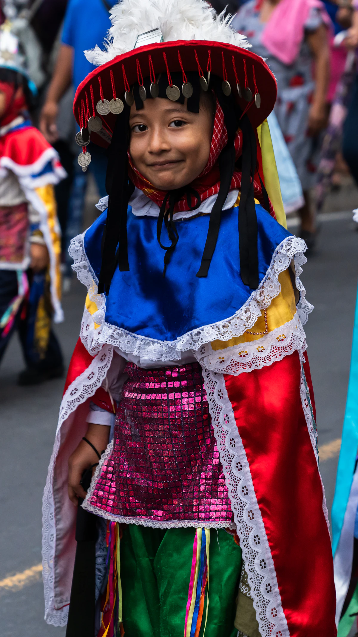A boy in a colorful festival costume