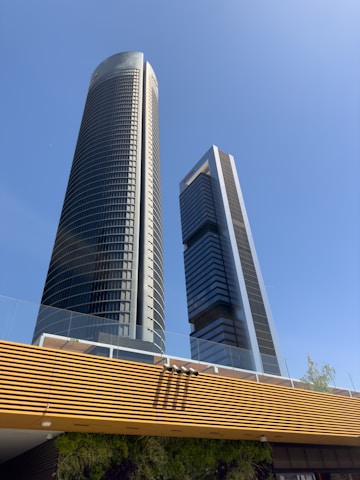 A couple of tall buildings sitting next to each other