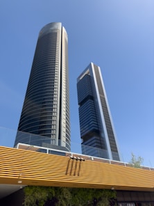 A couple of tall buildings sitting next to each other