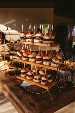 A wooden table topped with lots of pastries