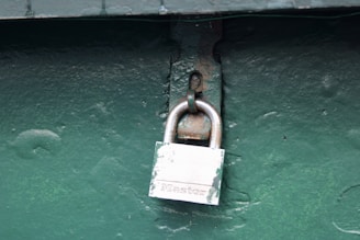 A padlock attached to the side of a building
