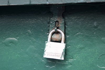 A padlock attached to the side of a building