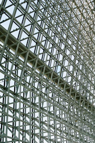 A large metal structure with a clock on it's side