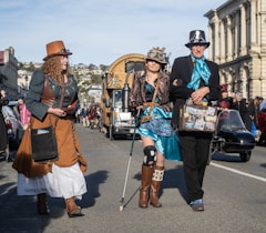 A group of people walking down a street