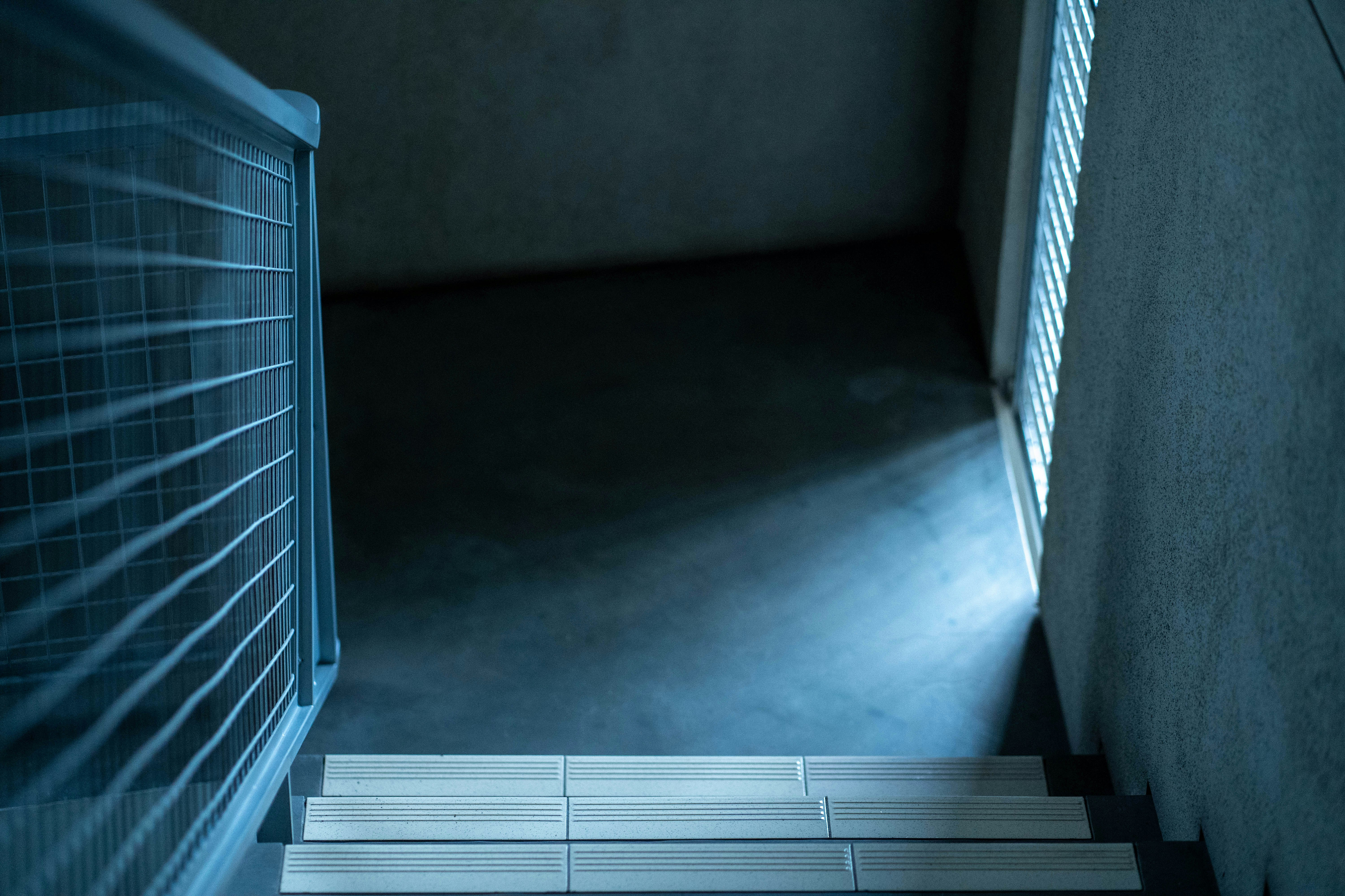 A stairway leading up to a window in a building