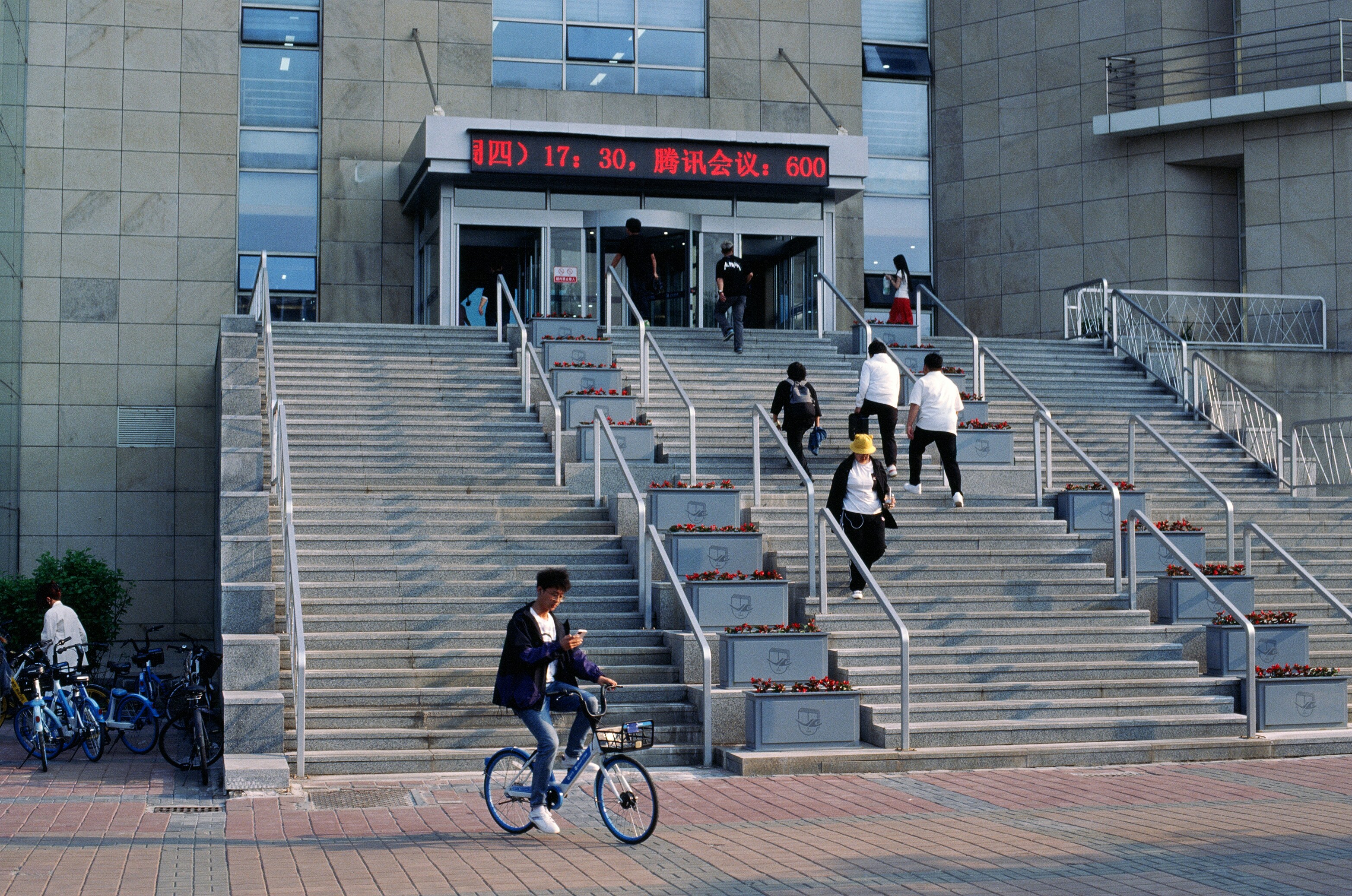 A man riding a bike down a set of stairs