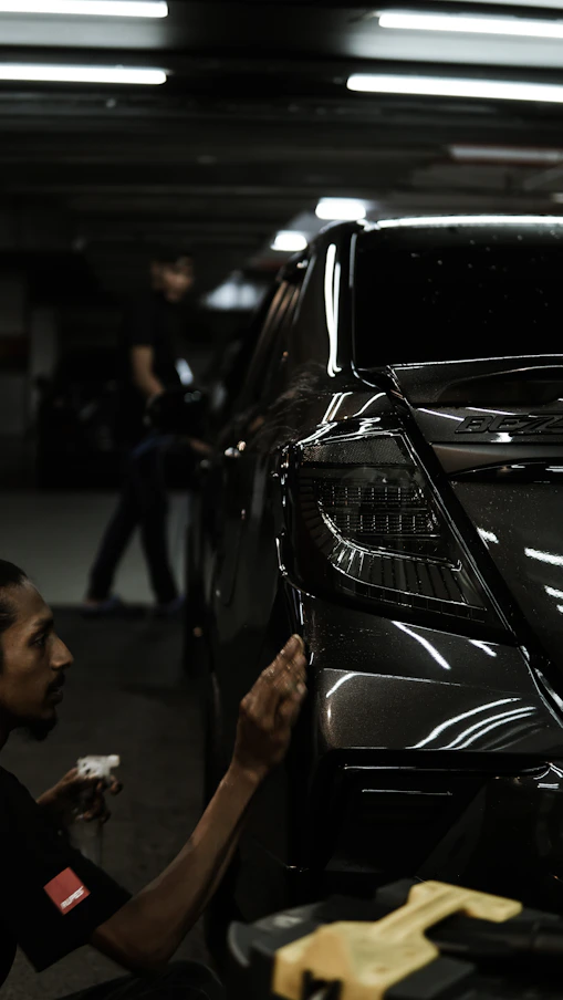 A man working on a car in a garage