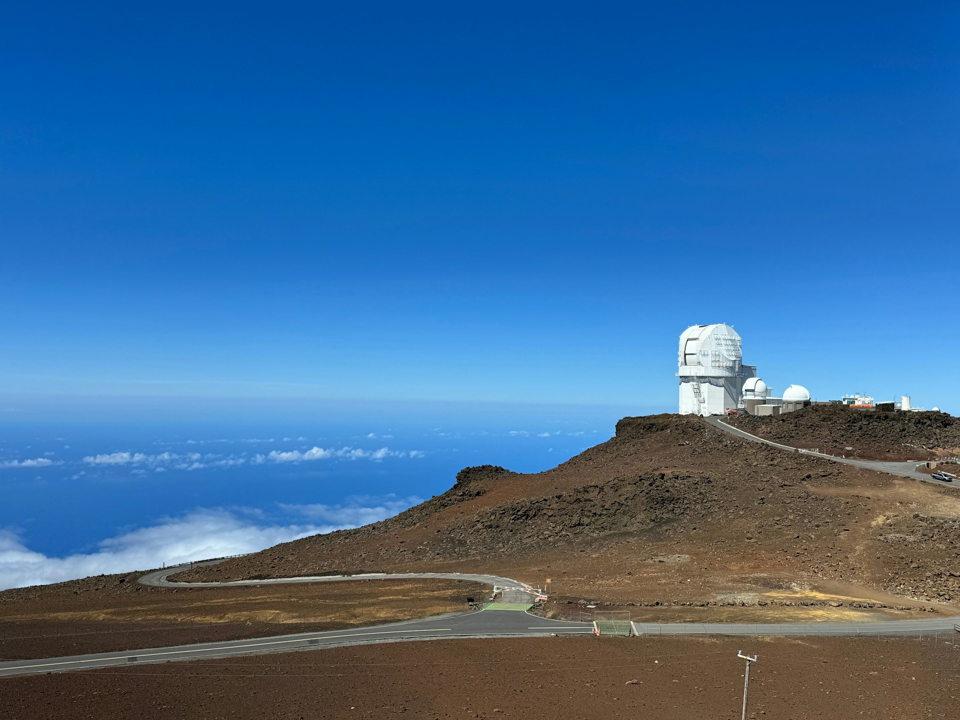 A hill with a satellite dish on top of it
