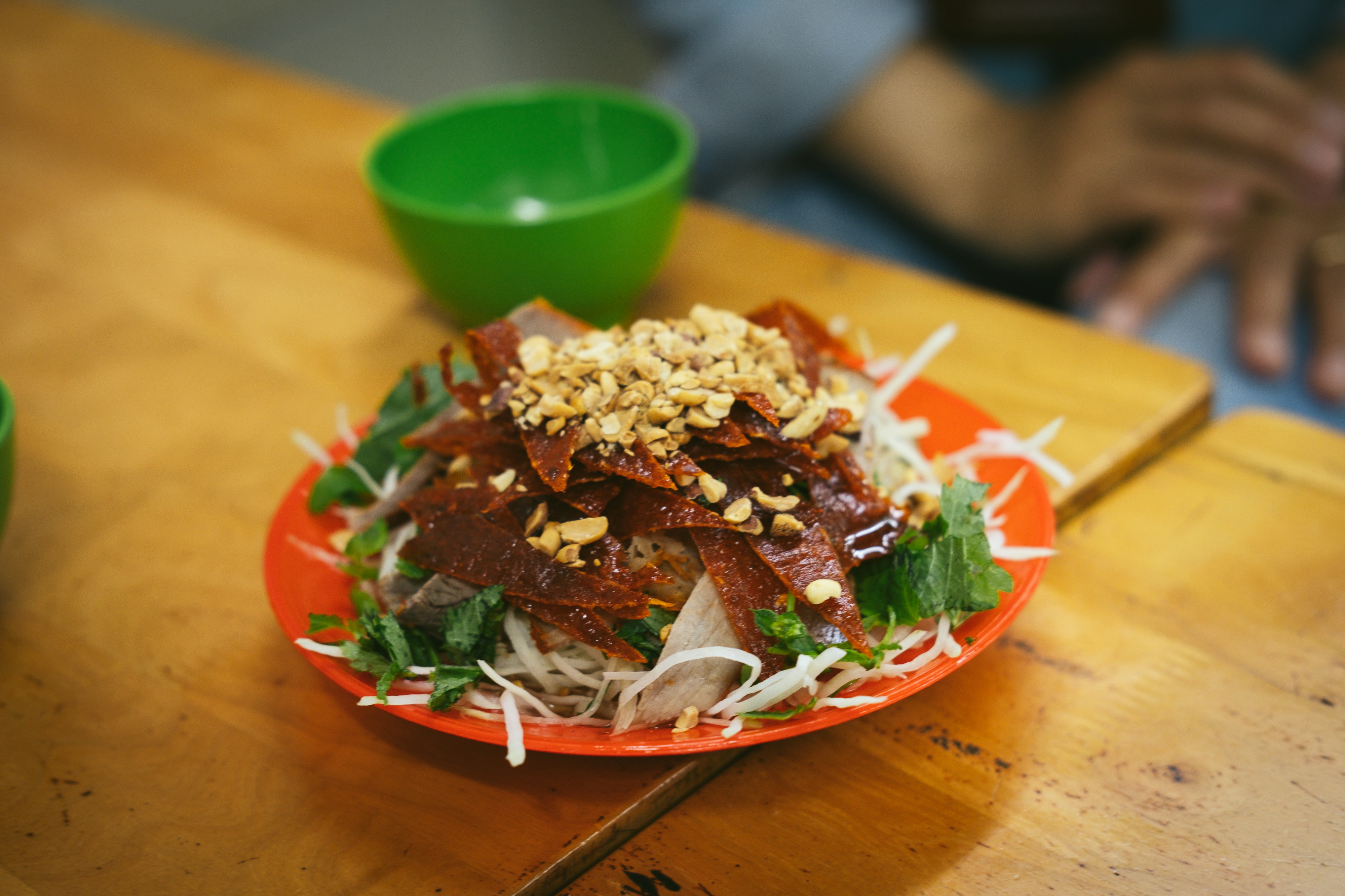 A plate of food on a wooden table, 