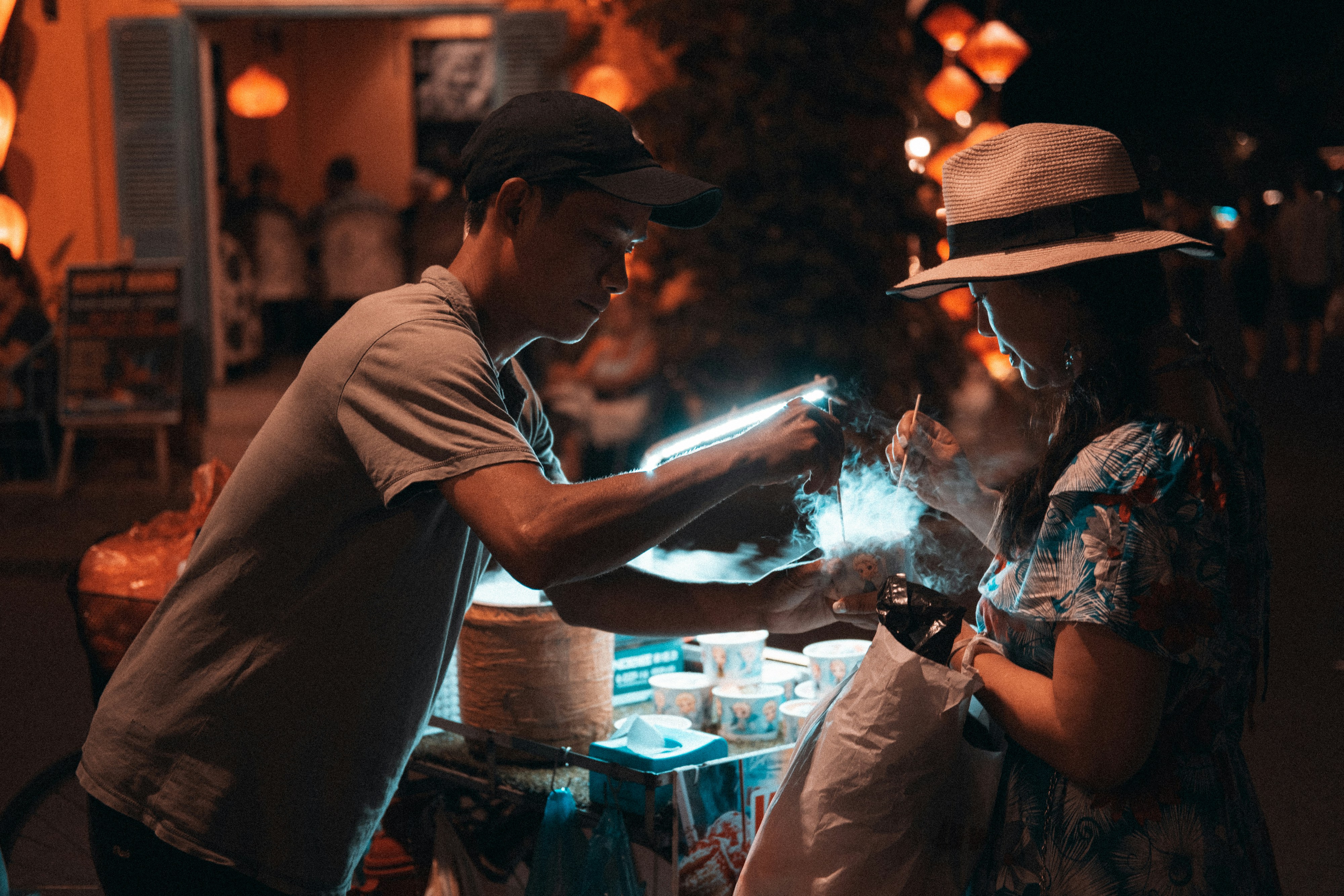 A man and a woman standing next to each other, 