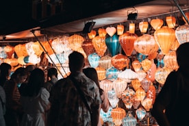 A group of people standing in front of a wall of lights