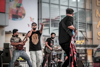 A group of men standing on top of a stage